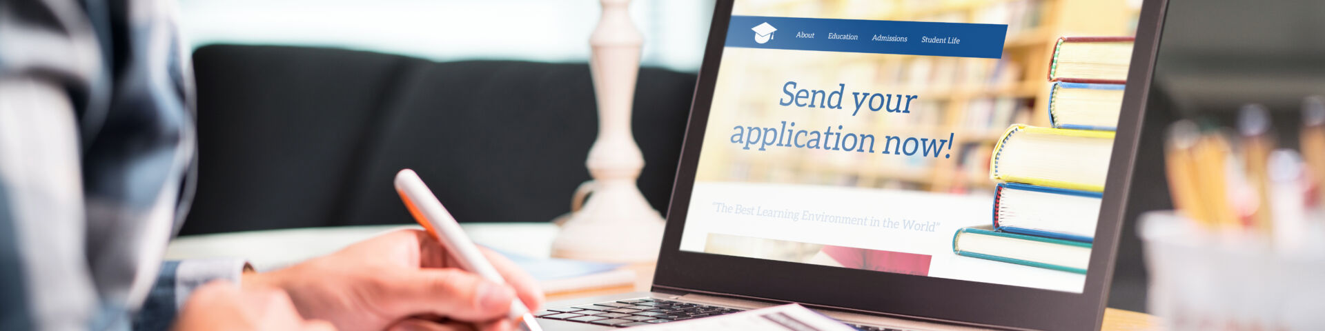 Student applying for admission. School website on laptop screen