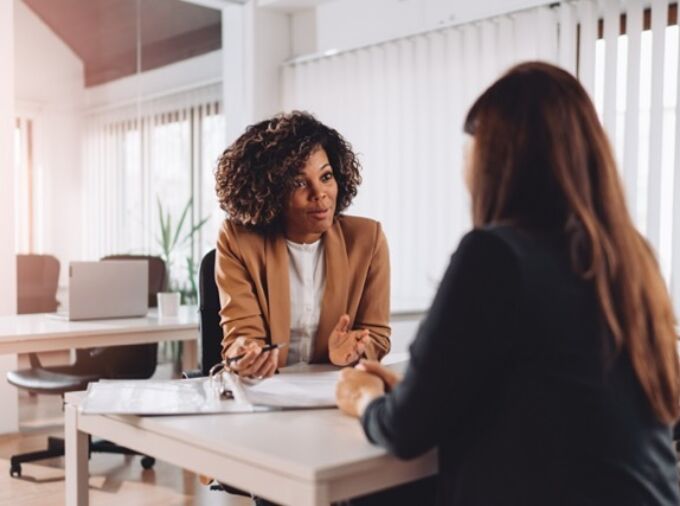 Young woman consulting with a student.