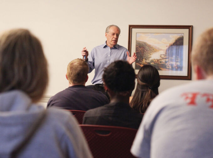 Amb. Dennis Jett teaching a class full of students