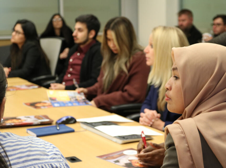 Student in hijab at table